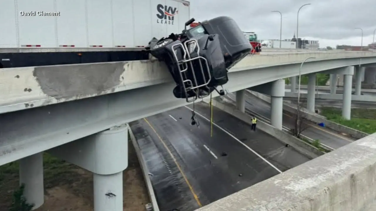 Louisville crash leads to dramatic rescue of a semi truck driver dangling off bridge